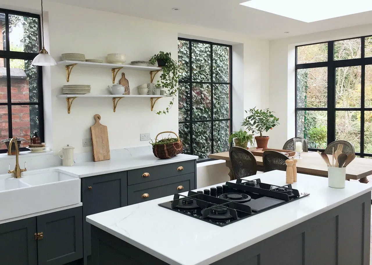 Scandinavian style kitchen island with shelves and trailing plants